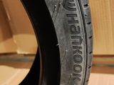 an image of a close up of a tire on a cardboard box