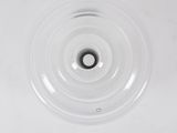 a white sink with a black drain in it