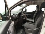 the interior of a white car with black leather seats and a steering wheel