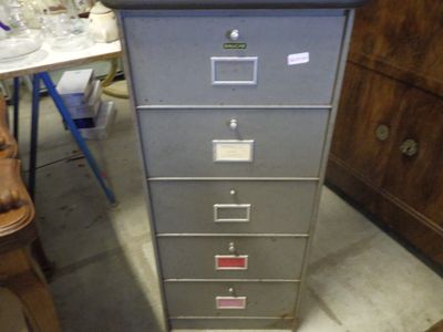 a filing cabinet that has a lot of drawers on it