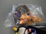 a plastic bag with toys inside of it on a table