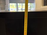 a measuring tape that is on top of a table