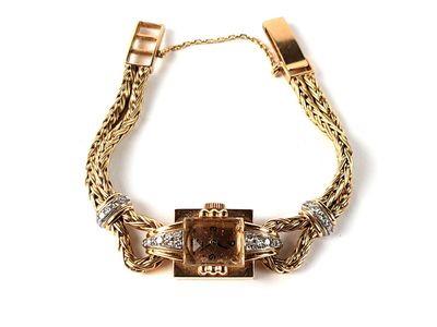 gold bracelet with a brown stone and diamonds on a white background