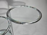a pair of glasses sitting on a table with a magnifying glass