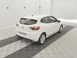a white car parked in a garage with a checkered floor