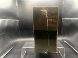 a glass display case with a gold piece on top of it