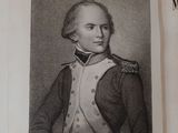 an old book with a picture of a man in military clothing