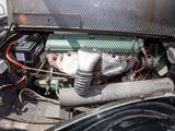 an old car engine with a lot of rust on it