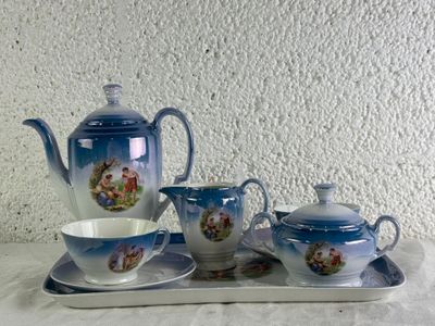 a tray with a tea set on it on a table