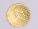 a gold coin with a picture of a man ' s face on it