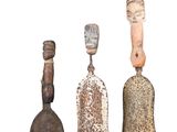three different types of bells are displayed on a white surface