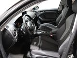the interior of a car with the door open and the driver ' s seat down