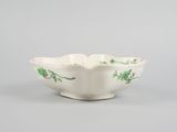 an image of a white bowl with green flowers on it