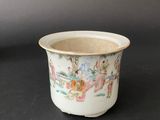 an image of a small cup with a painting on it