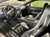 the interior of a black sports car is clean and ready to be driven