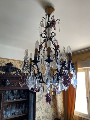 a chandelier that is hanging from the ceiling in a room