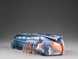 a sculpture of a fish that is sitting on a table