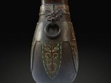 a brown vase with green designs on it on a black background