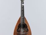 a close up of a mandolin hanging from a string