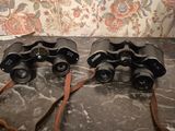 two binoculars that are sitting on a table