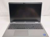 an open laptop computer sitting on top of a white table