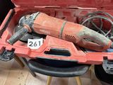 a red tool box with tools in it on the floor
