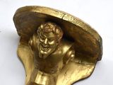 a statue of a man with a hat on it ' s head