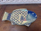 a decorative fish that is sitting on a table
