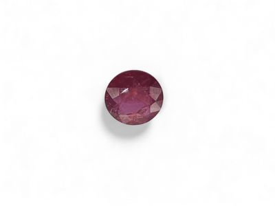 an oval cut ruby gems on a white background