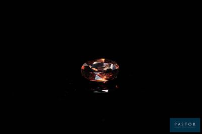 an oval shaped diamond with a dark background