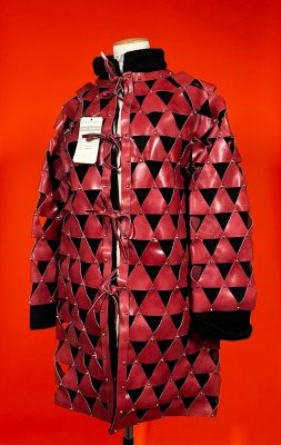 red leather jacket with black and white triangles on a mannequin mannequin mannequin mannequin mannequin mannequin mannequin mann
