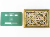 a small box with a game board inside of it