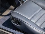 a close up view of a car ' s leather seat with buttons