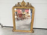 a mirror that is sitting on the floor in a room