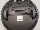 a black robot that is sitting on a table