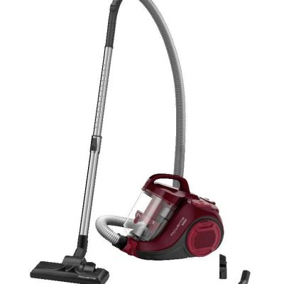 un aspirateur rouge muni d'un tuyau et d'un raccord fixé à celui-ci