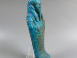 a close up of a statue of a hand holding a bird