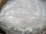 a box with a bag of white yarn inside of it