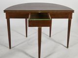 a small table with a drawer underneath it on a white surface