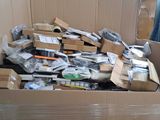 a cardboard box full of assorted items in a room