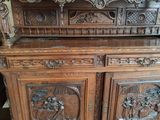 a large wooden cabinet with carvings on it