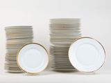 many plates stacked on top of each other on a table