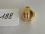 an image of a gold ring with diamonds on a white surface