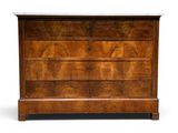 an antique chest of drawers with marble top
