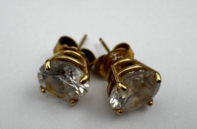 pair of diamond earrings on white background