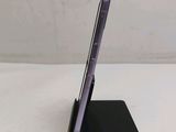 an image of a cell phone is sitting on a black stand
