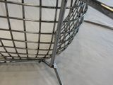 a metal basket that is sitting on a table