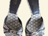 the back of a pair of women ' s shoes with a buckle on them