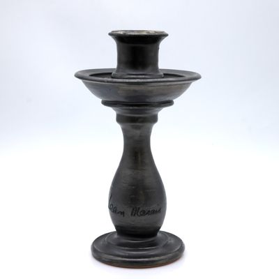 an image of a black candle holder on a white background