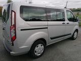 a silver van that is parked in the parking lot